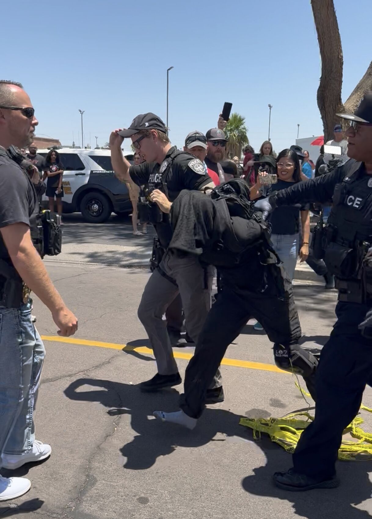 Police take protester away .jpg